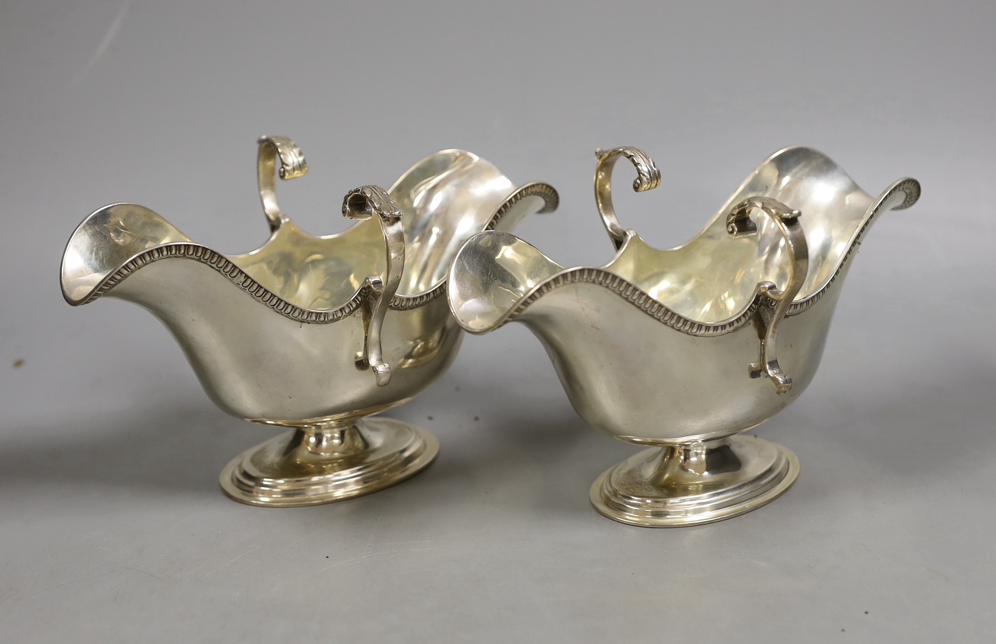 A pair of late Victorian Scottish silver double lipped sauceboats, Hamilton & Inches, Edinburgh, 1898, 11oz.